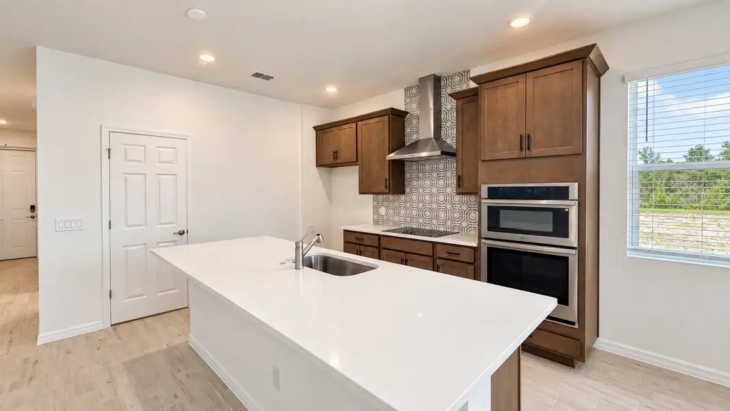 Furnished interior view inside a new home in Trinity Gardens, Deland (Image 3).