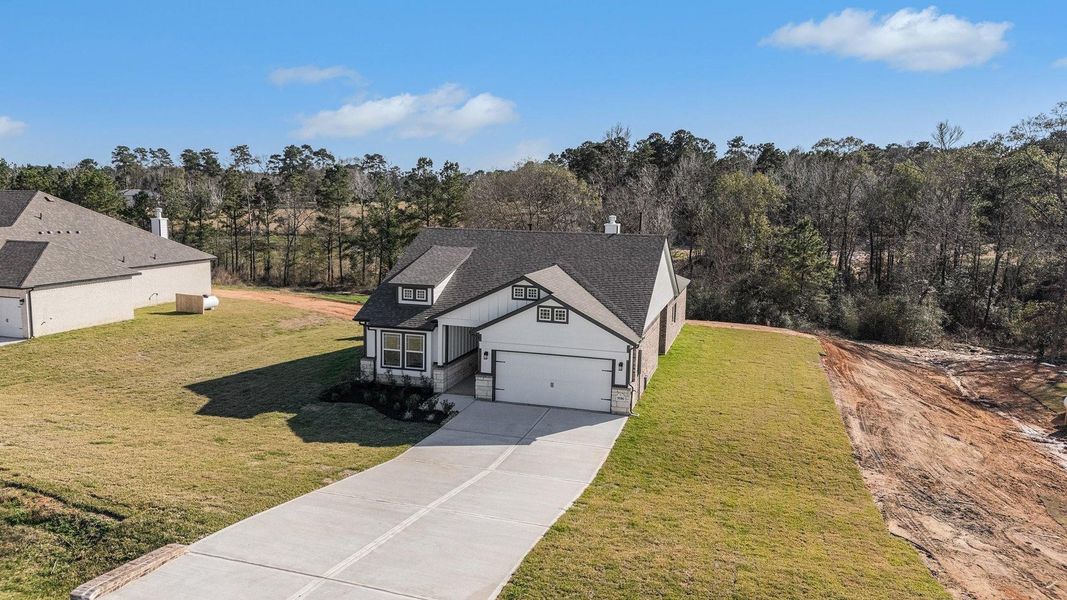 Front exterior of a new home in Rose Hill Estates, Willis, TX, highlighting curb appeal (Image 23).