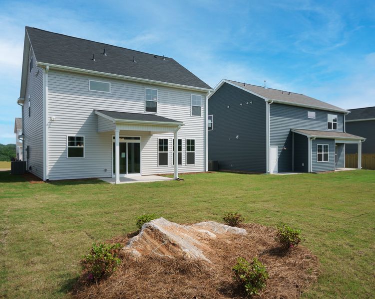 Representative exterior photo of a completed home built from the The Harrison by Cothran Homes in Holly Ridge, Greenville, SC (Image 32). Representative exterior photo of a completed home built from the The Harrison by Cothran Homes in Holly Ridge, Greenville, SC (Image 32).