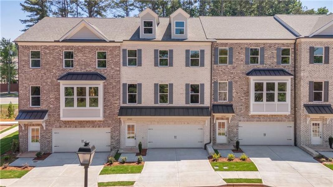 Front exterior of a new home in , Suwanee, GA, highlighting curb appeal (Image 1). Front exterior of a new home in , Suwanee, GA, highlighting curb appeal (Image 1).