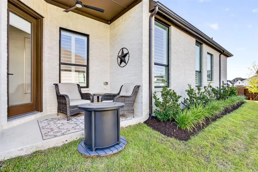 Sweet little side porch for those quiet moments with a cup of coffee or a glass of wine. Water works, too. Sweet little side porch for those quiet moments with a cup of coffee or a glass of wine. Water works, too.
