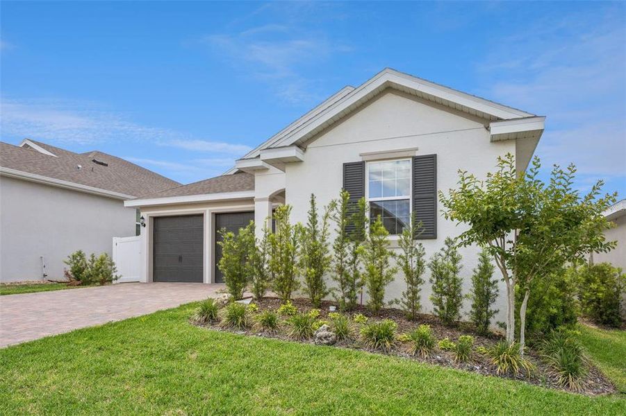 Front exterior of a new home in , Minneola, FL, highlighting curb appeal (Image 23).