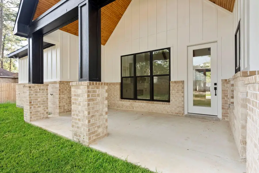 Exterior details and patio area of a home in , New Caney (Image 2).