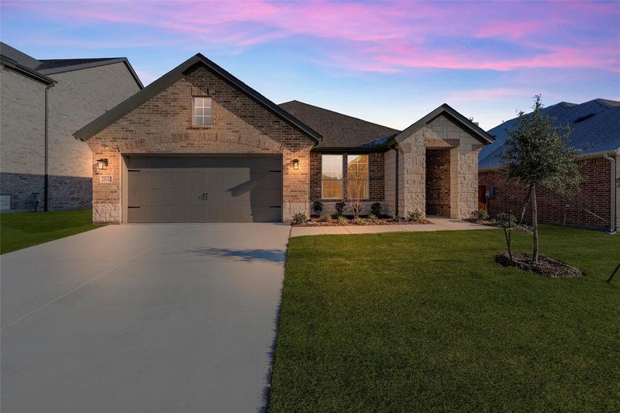 Front exterior of a new home in Northstar, Haslet, TX, highlighting curb appeal (Image 23). Front exterior of a new home in Northstar, Haslet, TX, highlighting curb appeal (Image 23).