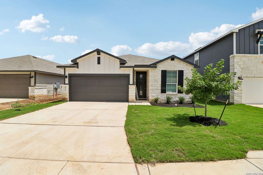 Front exterior of a new home in Estancia Ranch - Premier Series, San Antonio, TX, highlighting curb appeal (Image 22).