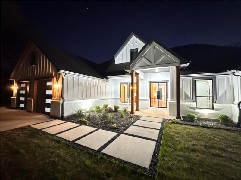Front exterior of a new home in , Poetry, TX, highlighting curb appeal (Image 2). Front exterior of a new home in , Poetry, TX, highlighting curb appeal (Image 2).