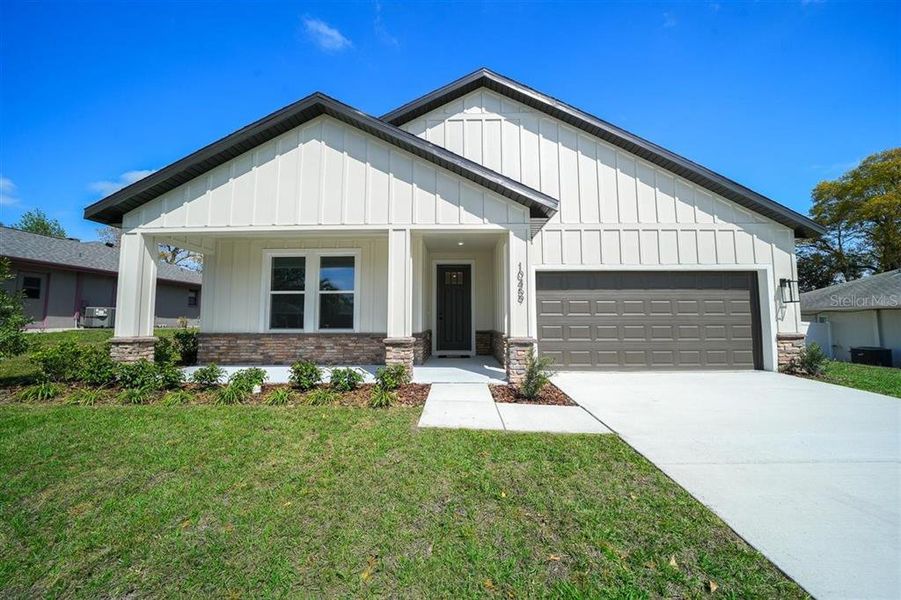 Front exterior of a new home in , Spring Hill, FL, highlighting curb appeal (Image 1). Front exterior of a new home in , Spring Hill, FL, highlighting curb appeal (Image 1).