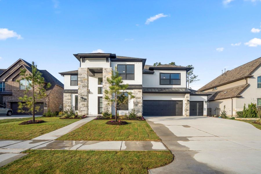 Front exterior of a new home in ARTAVIA 70′ Lots, Conroe, TX, highlighting curb appeal (Image 25).