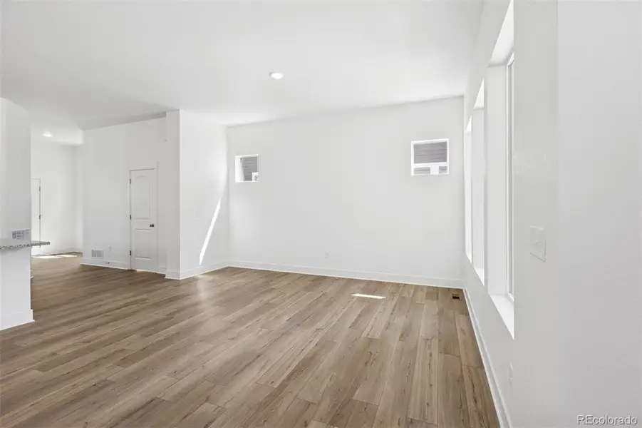 Spacious, unfurnished interior of a new home in Painted Prairie Cottage, Aurora (Image 32).