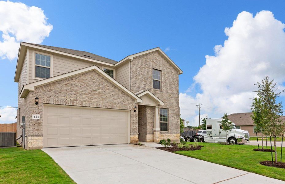Front exterior of a new home in Sonterra, Jarrell, TX, highlighting curb appeal (Image 2). Front exterior of a new home in Sonterra, Jarrell, TX, highlighting curb appeal (Image 2).