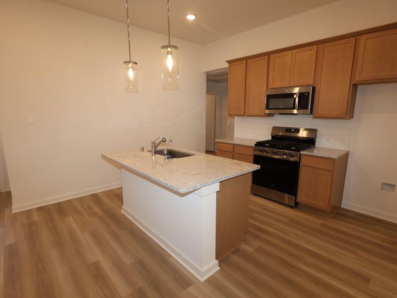 Furnished interior view inside a new home in Pinewood at Grand Texas, New Caney (Image 7).
