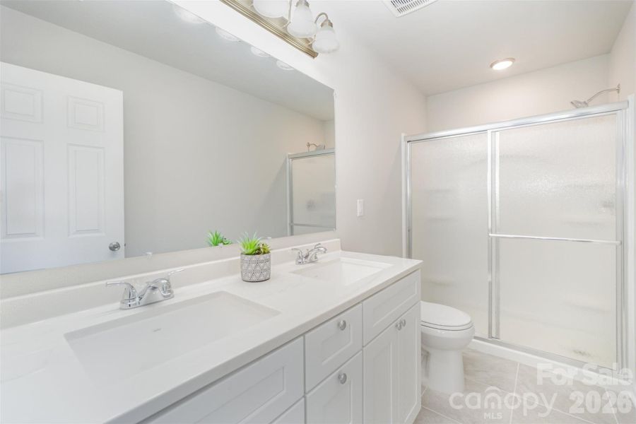 Primary suite walk-in closet Primary suite walk-in closet