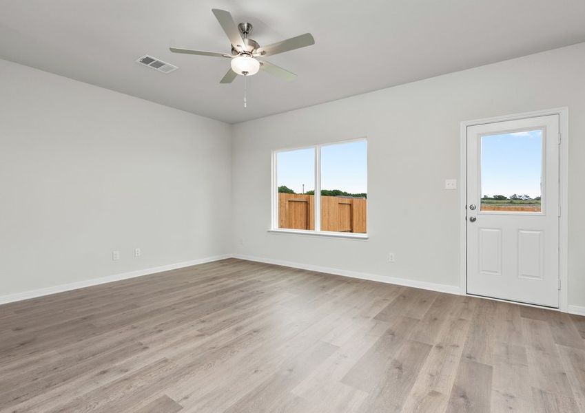 The large living room has a window that lets in great, natural light and backyard views. The large living room has a window that lets in great, natural light and backyard views.