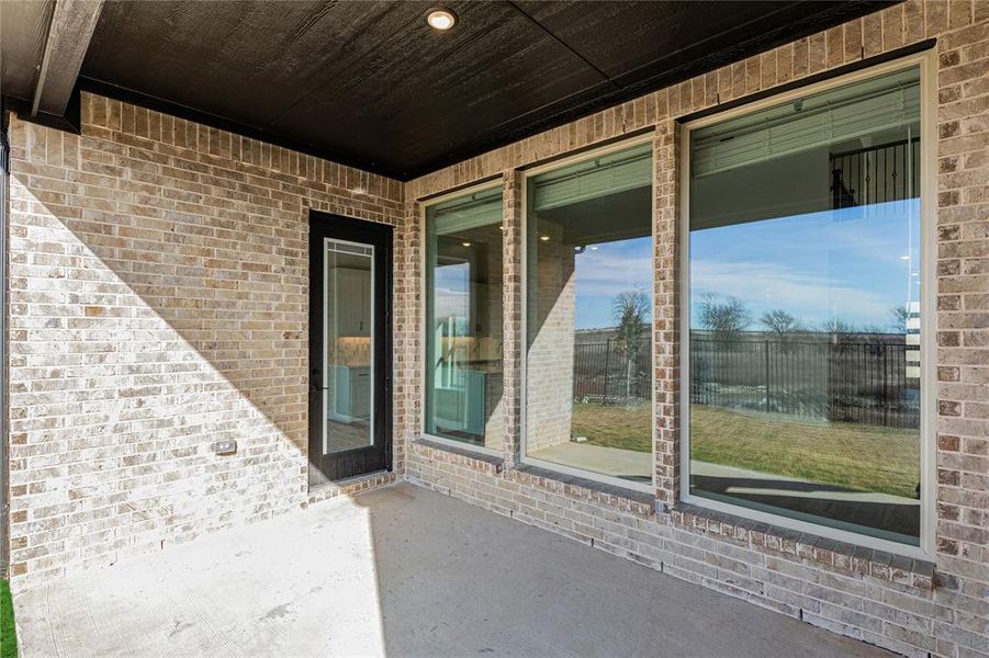 Exterior details and patio area of a home in Creekview Meadows, Pilot Point (Image 26).