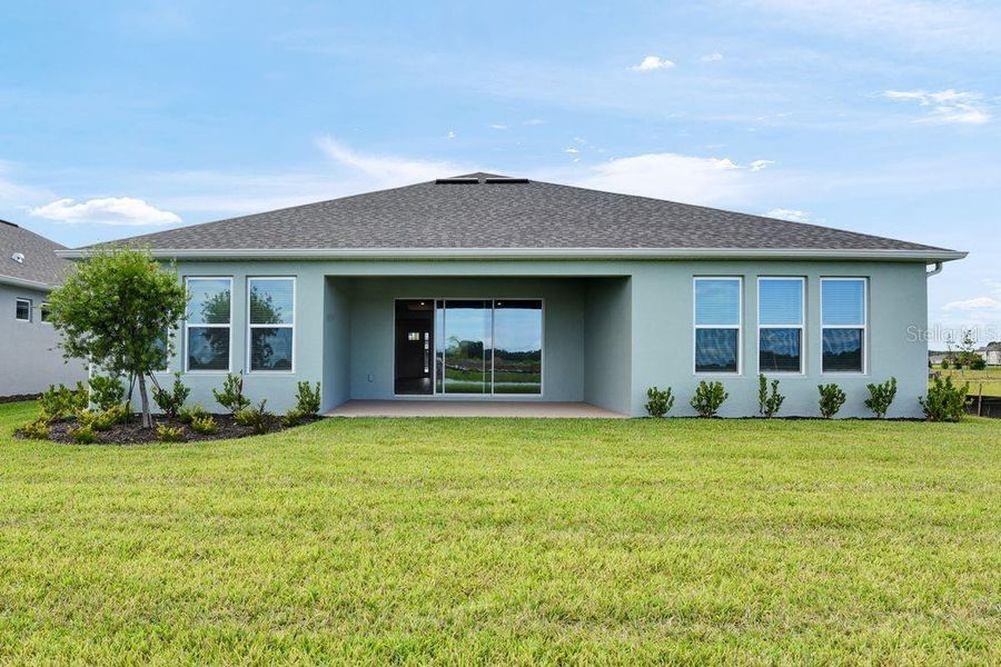 Front exterior of a new home in Ardisia Park, New Smyrna Beach, FL, highlighting curb appeal (Image 27).