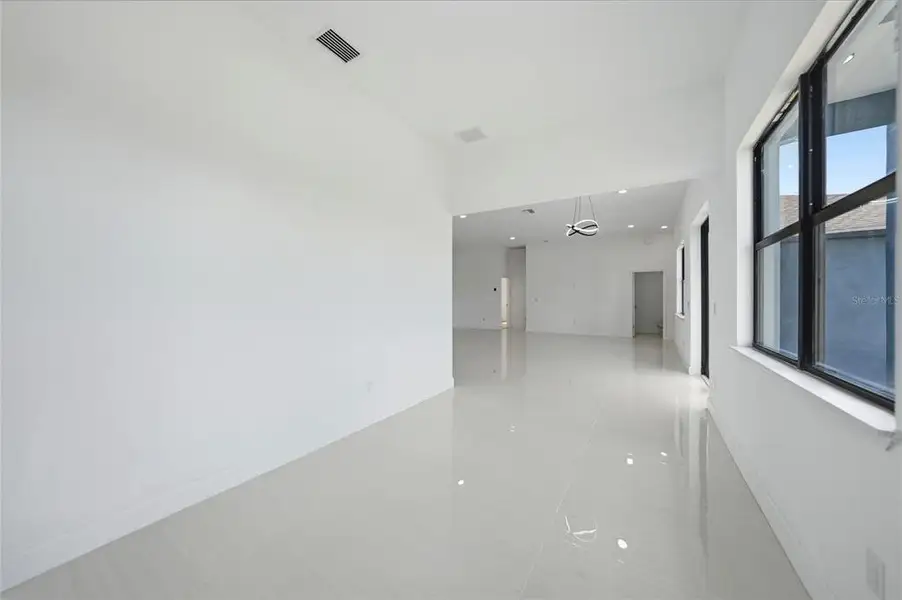 Spacious, unfurnished interior of a new home in , Port Charlotte (Image 22).