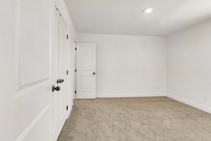 Representative unfurnished interior of a home built from the Titusville II by Regent Homes in Marlon's Creek, Spring Hill (Image 36).