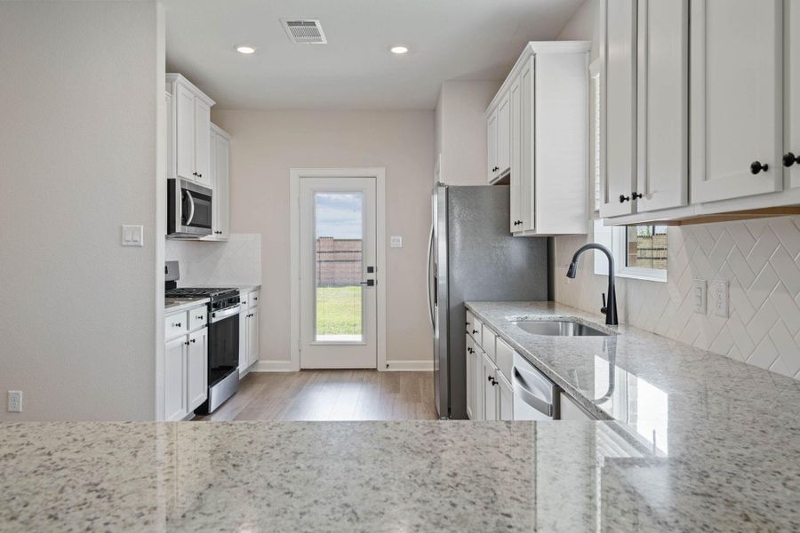Furnished interior in a model home at Emberly in Beasley (Image 7).