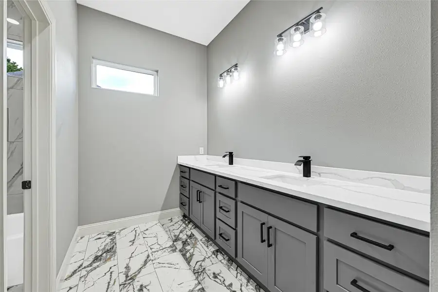 Second full bath offers a double sink vanity. Perfect to accommodate more than one. Second full bath offers a double sink vanity. Perfect to accommodate more than one.