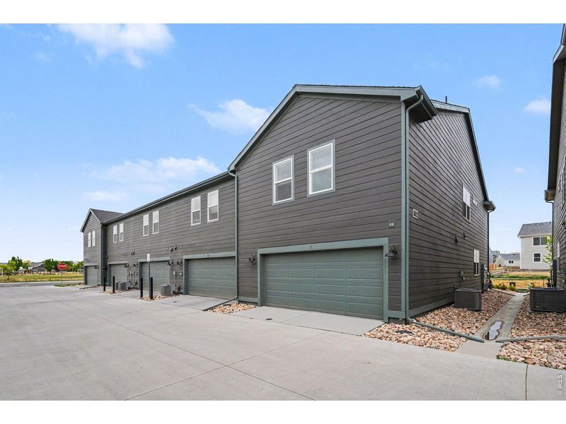 Front exterior of a new home in Poudre Heights: The Meadow Collection, Windsor, CO, highlighting curb appeal (Image 1). Front exterior of a new home in Poudre Heights: The Meadow Collection, Windsor, CO, highlighting curb appeal (Image 1).