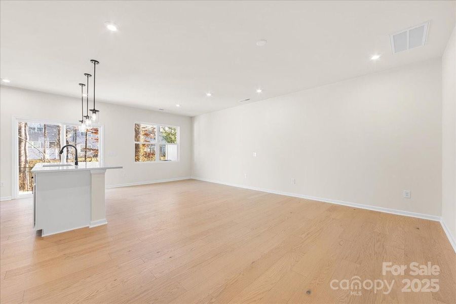 Great Room and Dining Seamlessly Blended Into Kitchen.