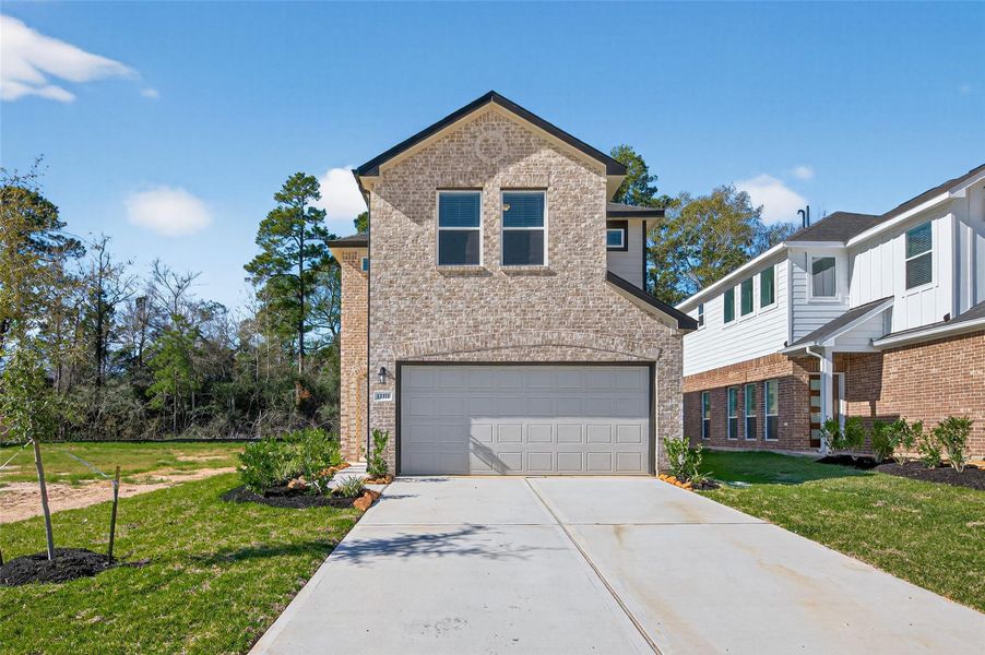 Front exterior of a new home in Enclave at Willis, Willis, TX, highlighting curb appeal (Image 24).