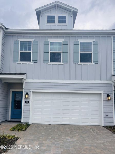 Front exterior of a new home in Cherry Elm at SilverLeaf, St. Augustine, FL, highlighting curb appeal (Image 1). Front exterior of a new home in Cherry Elm at SilverLeaf, St. Augustine, FL, highlighting curb appeal (Image 1).