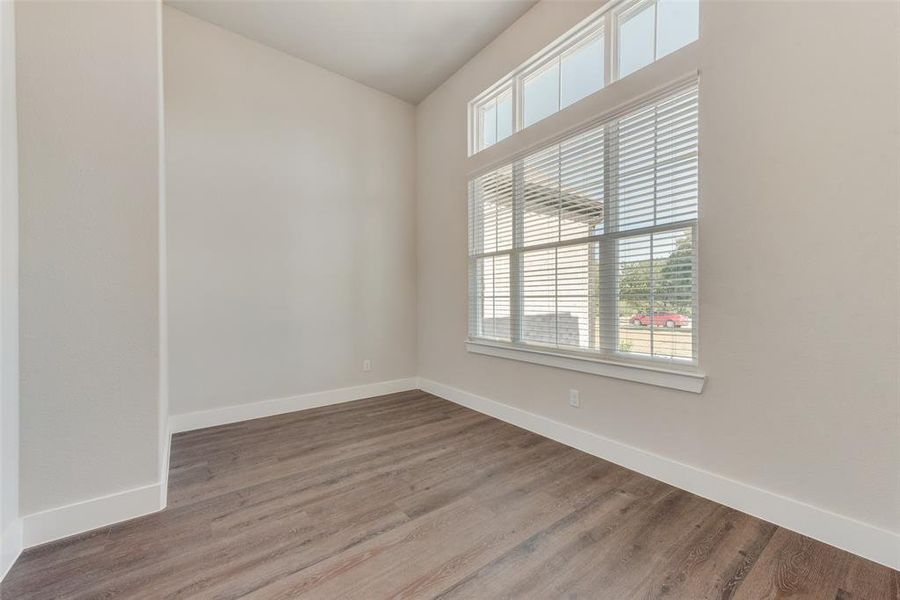 Empty room featuring hardwood / wood-style flooring