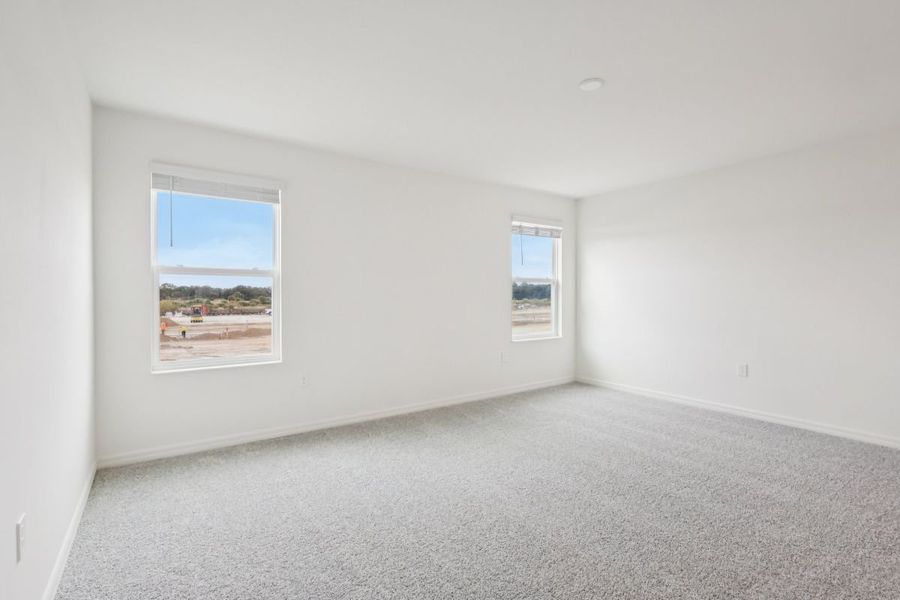 Spacious, unfurnished interior of a new home in Gardens at Waterstone I, Palm Bay (Image 6).