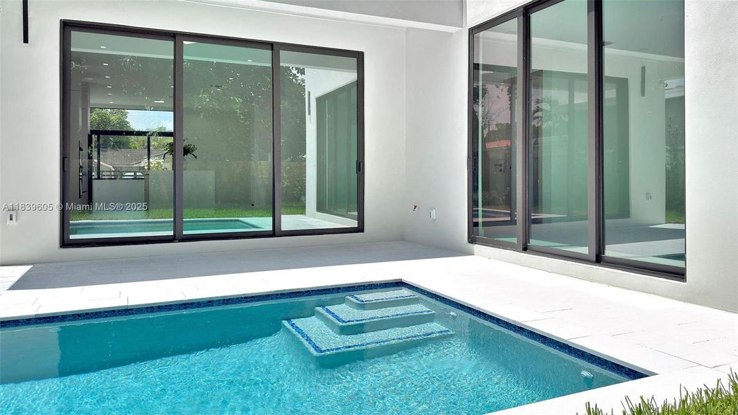 Exterior details and patio area of a home in , Miami (Image 4).