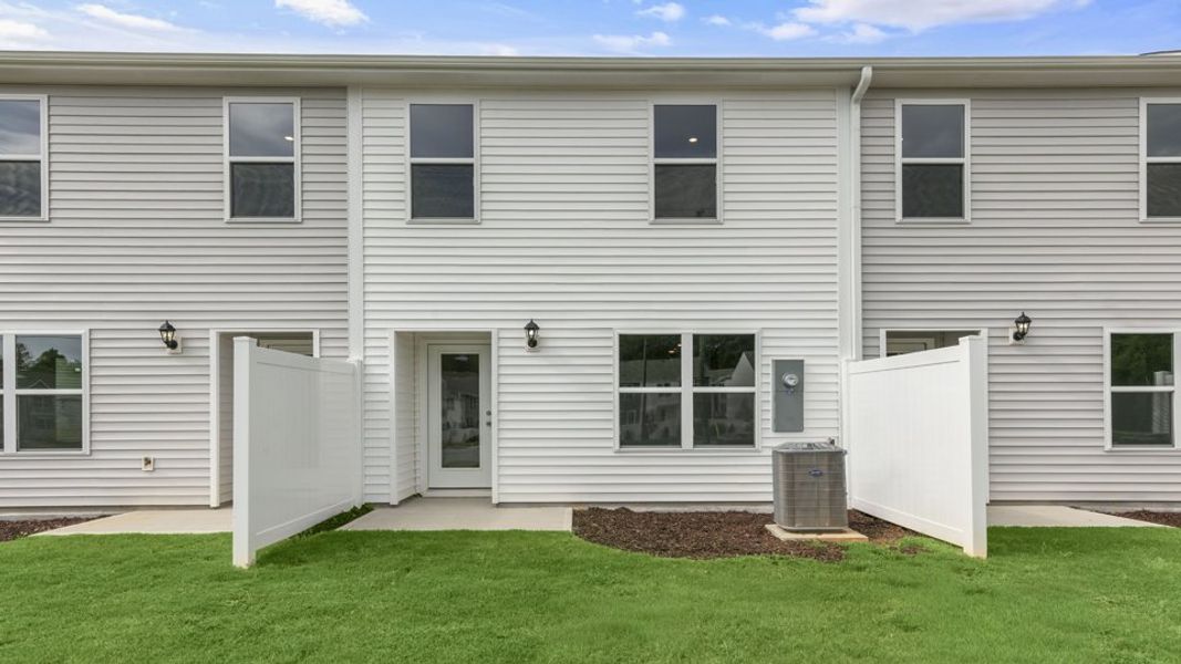 Exterior details and patio area of a home in The Townes at Wilson's Ridge, Smithfield (Image 17).