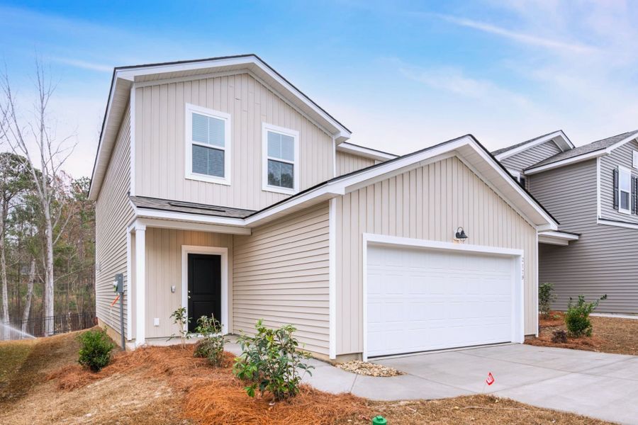 Front exterior of a new home in Grand Arbor, Blythewood, SC, highlighting curb appeal (Image 2). Front exterior of a new home in Grand Arbor, Blythewood, SC, highlighting curb appeal (Image 2).