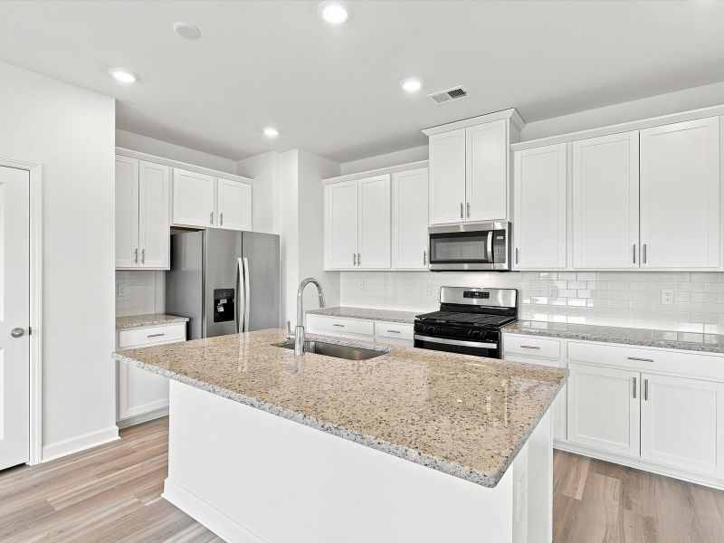Furnished interior view inside a new home in Waterside - Boardwalk Series, Longs (Image 4).