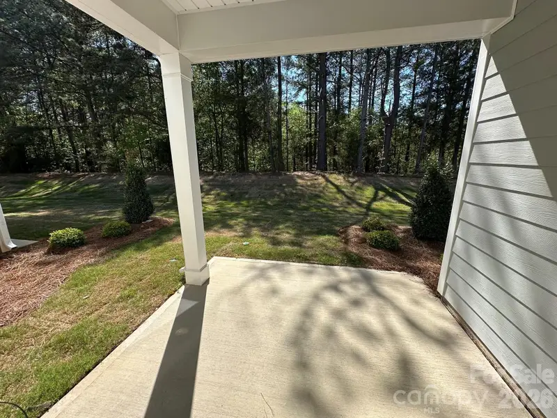 Exterior details and patio area of a home in Blythe Mill Townhomes, Waxhaw (Image 3).