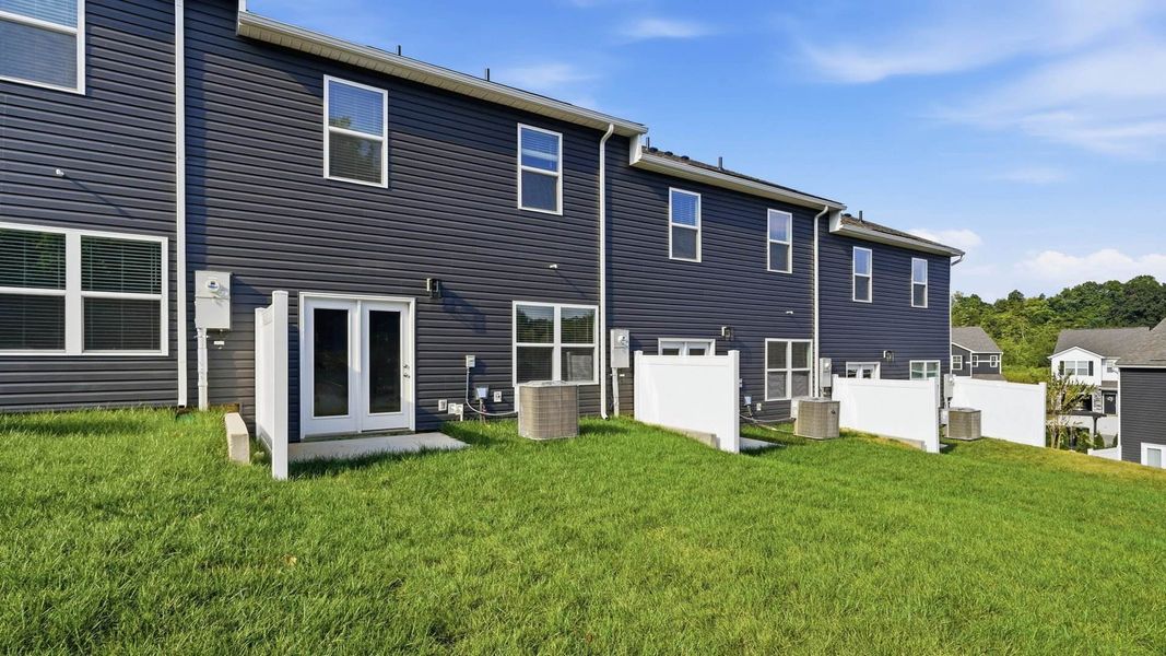 Exterior details and patio area of a home in The Arbor Townhomes, Kingsport (Image 4).