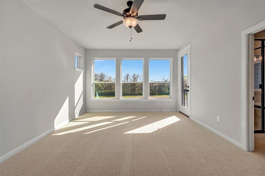 Spare room with a ceiling fan and light carpet Spare room with a ceiling fan and light carpet