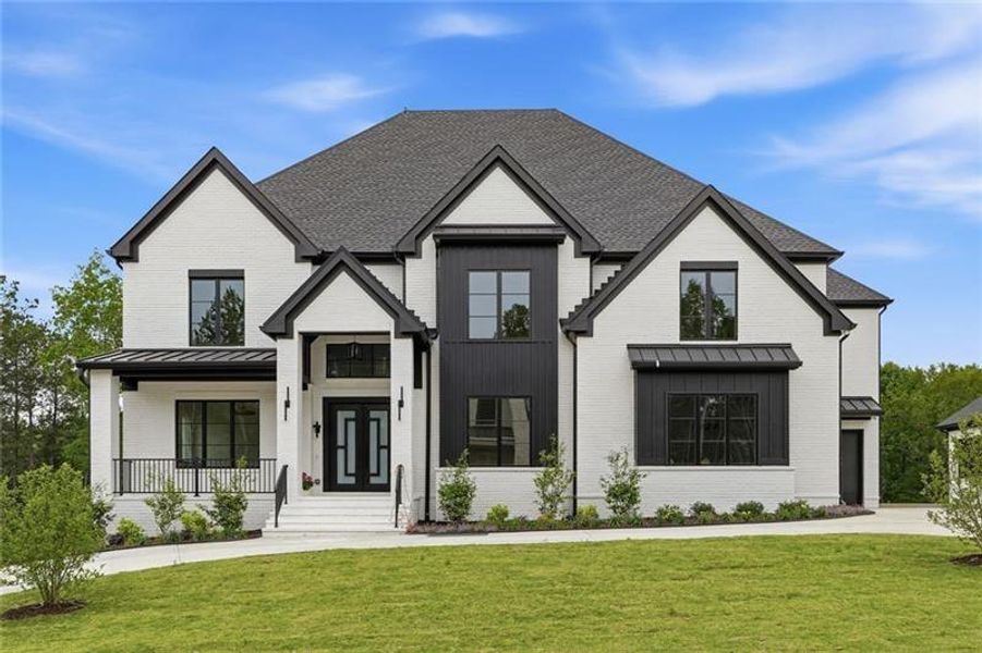 Front exterior of a new home in , Cumming, GA, highlighting curb appeal (Image 2). Front exterior of a new home in , Cumming, GA, highlighting curb appeal (Image 2).