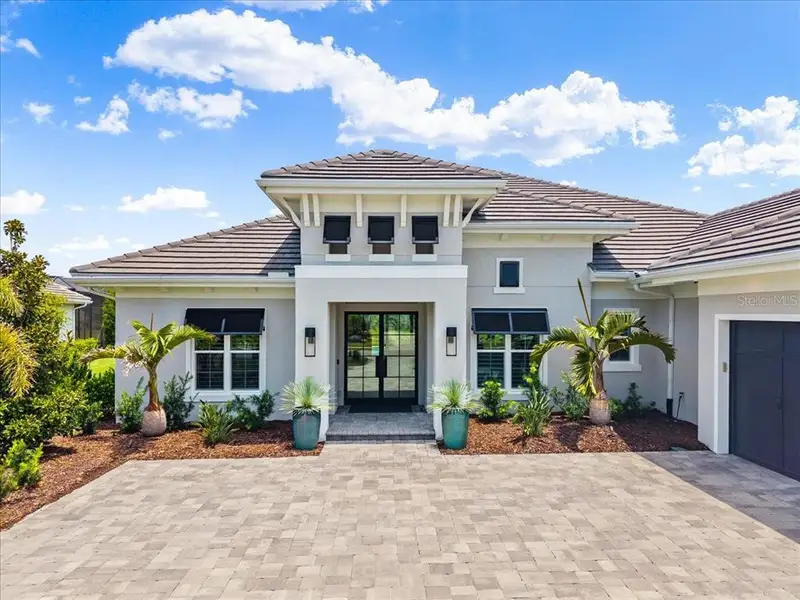 Front exterior of a new home in , Lakewood Ranch, FL, highlighting curb appeal (Image 28). Front exterior of a new home in , Lakewood Ranch, FL, highlighting curb appeal (Image 28).