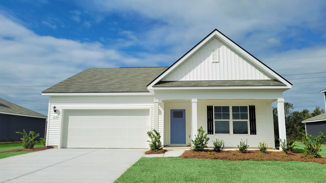 Front exterior of a new home in Dove Crossing, Conway, SC, highlighting curb appeal (Image 1).