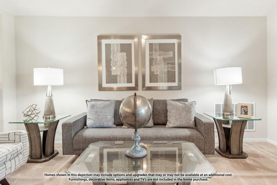 Living room with gray sofa, glass coffee table, two table lamps, and framed wall art above the couch Living room with gray sofa, glass coffee table, two table lamps, and framed wall art above the couch