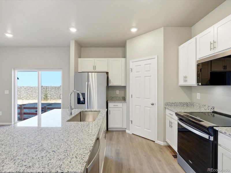 Furnished interior view inside a new home in , Thornton (Image 9).