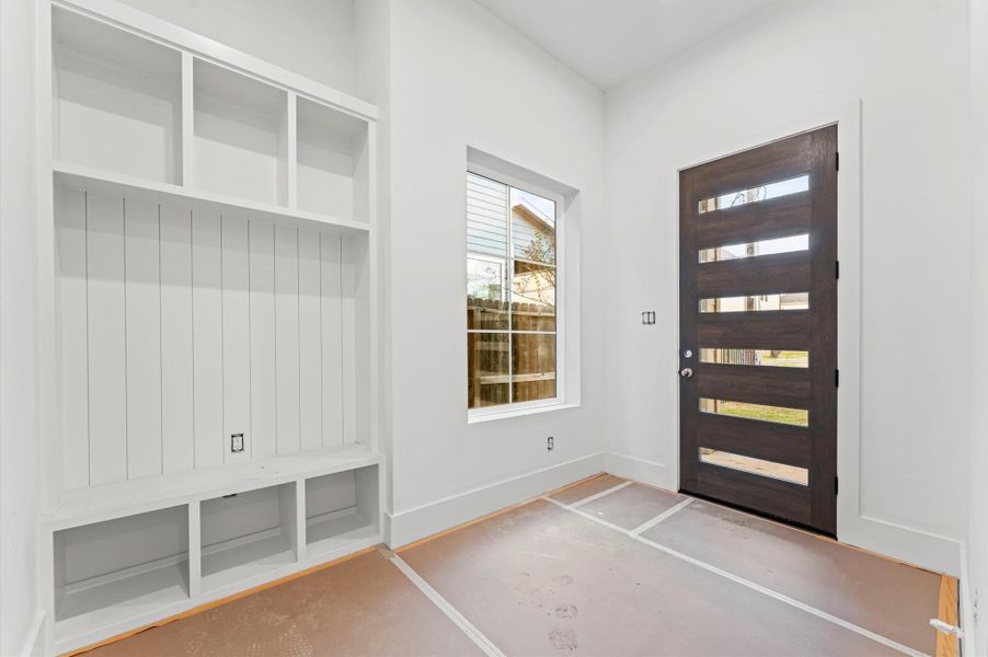 The mudroom is conveniently located just inside the front door and offers ample storage.