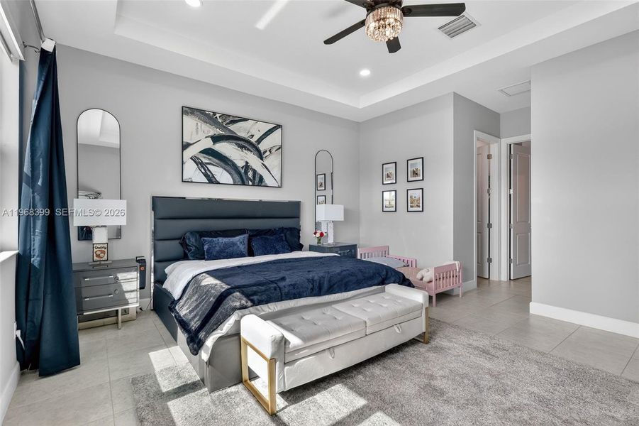 Primary suite with customizable LED ceiling lighting—choose from multiple colors to set the perfect ambiance.