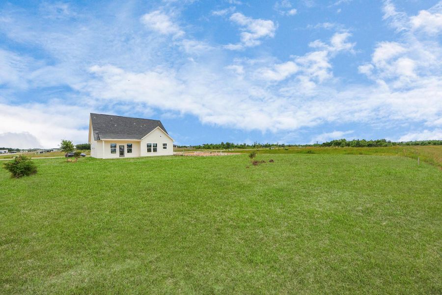 A modern, two-story home with a spacious driveway and a two-car garage. The exterior features a mix of light siding and dark accents, complemented by a neatly landscaped front path. Offering a serene and inviting atmosphere. A modern, two-story home with a spacious driveway and a two-car garage. The exterior features a mix of light siding and dark accents, complemented by a neatly landscaped front path. Offering a serene and inviting atmosphere.