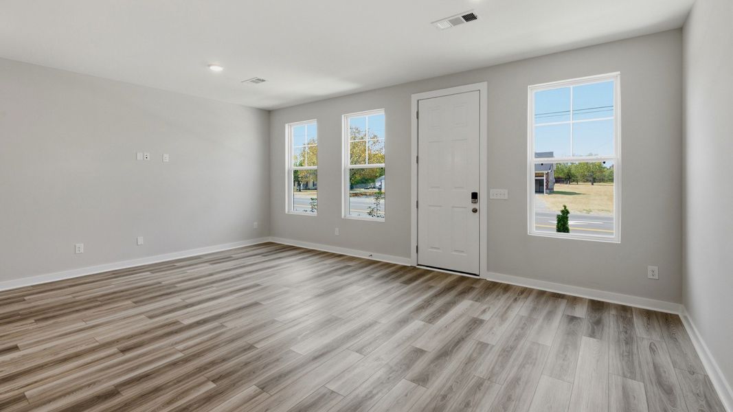 Front door with windows into spacious entryway