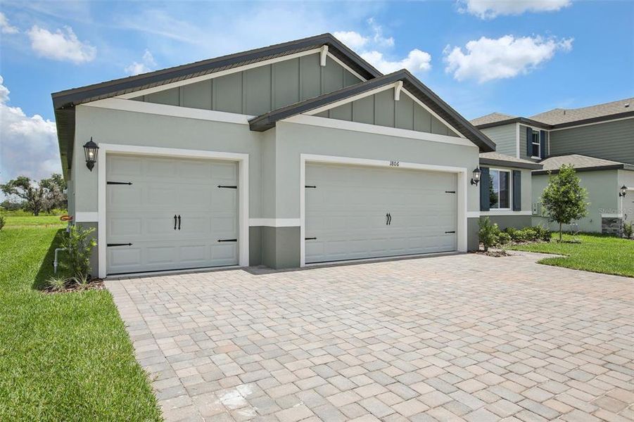 Front exterior of a new home in Two Rivers - Signature Series, Zephyrhills, FL, highlighting curb appeal (Image 2).