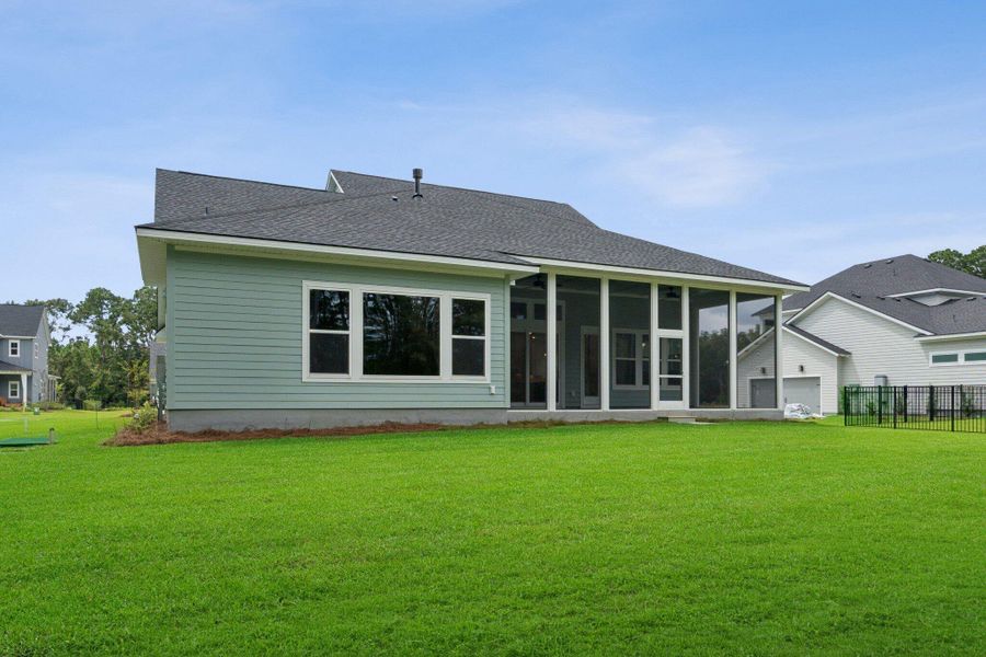 Exterior details and patio area of a home in Hidden Ponds Reserve, Awendaw (Image 27).
