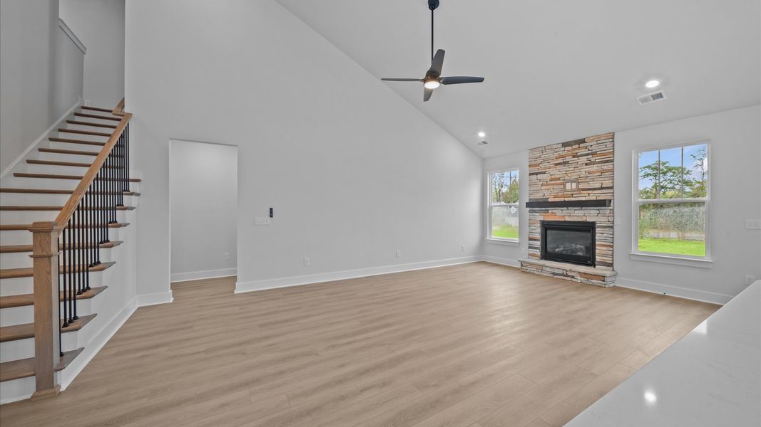 Notable two-story family room offering a grand yet inviting space for memorable everyday living Notable two-story family room offering a grand yet inviting space for memorable everyday living