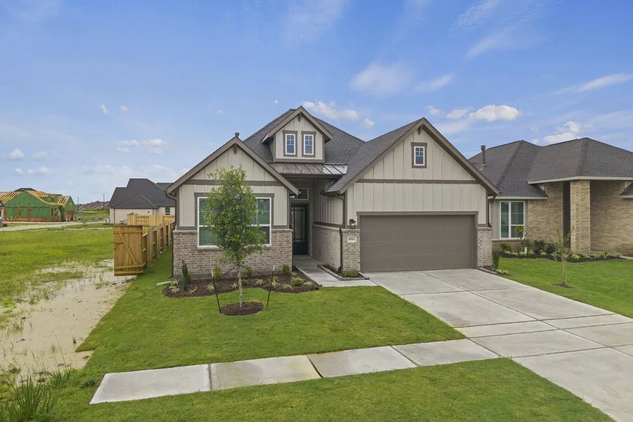 Representative exterior photo of a completed home built from the Summerton by Chesmar Homes in University Heights, Round Rock, TX (Image 21).