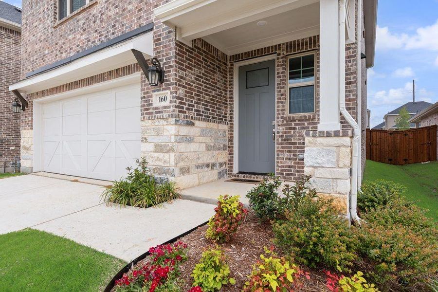Exterior details and patio area of a home in Spiritas Ranch, Little Elm (Image 4).
